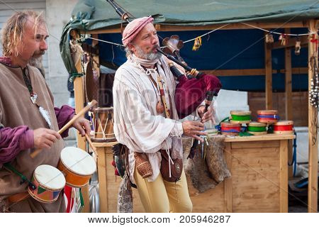 PALMANOVA ITALY - SEPTEMBER 03: Historical bagpiper and drummer dressed in ancient clothes during the historical Reenactment a.d. 1615 on September 03 2017