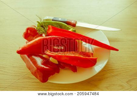 Red bell pepper backgro and Green Peppers. Fresh organic vegetables on table. Green and red bell pepper backgro. Fresh raw vegetables on the table - Retro color