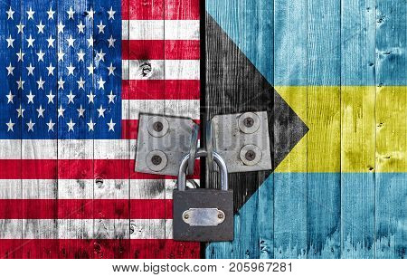 US and Bahamas flag on door with padlock