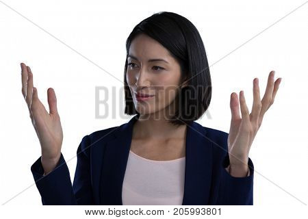 Close-up of businesswoman gesturing against white background