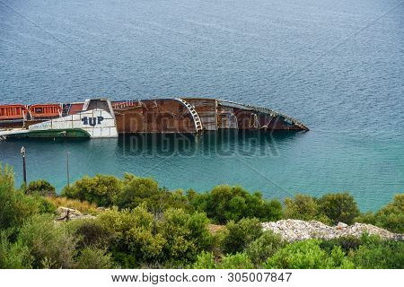 Piraeus, Greece - 15 May 2019: Capsized Cruise Liner In The Ocean Near Piraeus, Greece