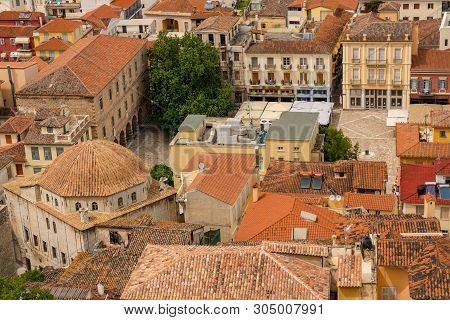 Nafplio, Greece - 15 May 2019: Aerial View Over The Old Tiled Roofs To Square In The City Of Nafplio