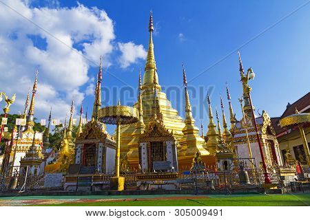 Pagoda Gold Beautiful With Cloud And Blue Sky At Wat Phra Bat Ban Tak, Tak Province, Of Thailand