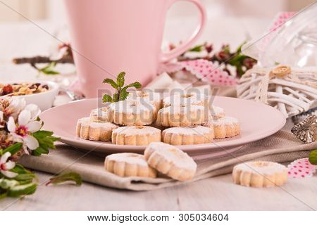 Canestrelli Biscuits With Icing Sugar On Wooden Table.