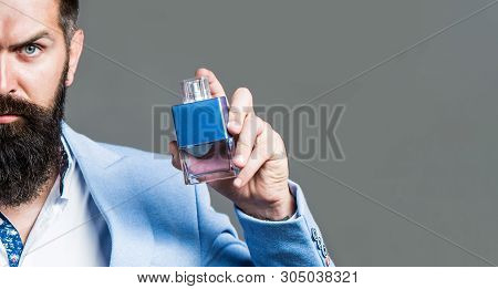 Man Perfume, Fragrance. Masculine Perfume. Male Fragrance And Perfumery, Cosmetics. Bearded Man Hold
