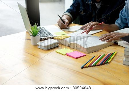 Woman And Man Work On The Table