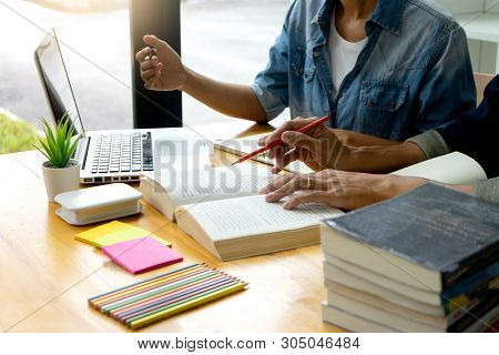 Woman And Man Work On The Table