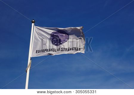 Strangnas, Sweden - June 5, 2019: Close-up Of The Europaskolan School Flag Against The Blue Sky.