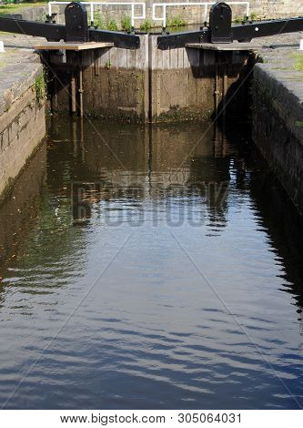 A Close Up Of Old Closed Wooden Lock Gates On The Calder And Hebble Navigation Canal In Brighouse Re