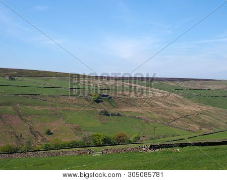 A Scenic View Of Green Meadows And Stone Walls Underneath Yorkshire Hills Ruined Farmhouses And Moor