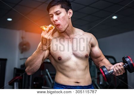 Strong Muscular Athlete Men With Pizza Fast Food. Unhealthy Eating Diet Concept.