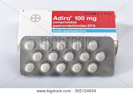 A Box Of Acetylsalicylic Acid Adiro Tablets Of The Bayer Brand Isolated On White. Infantile Aspirin.