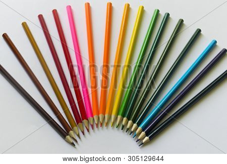 ..multicolored Pencils Lie On A White Table.