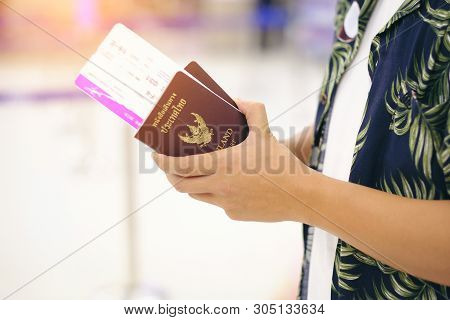 Closeup Of Man Holding Thailand Passports For The Trip Travel Robe Hawii At Airport