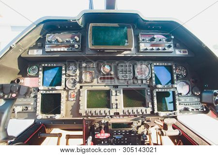 Black Control Panel In A Helicopter Cockpit.