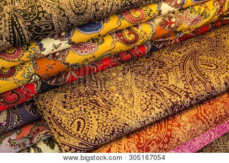 Beautiful Colorful Handmade Pashmina Shawls Decorated With Glittering Precious Stones Lie On The Sho