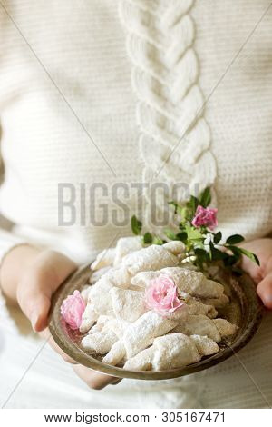 Traditional Romanian Or Moldavian Shortcake Cookies With Jam Stuffing On A Tray In Female Hands.