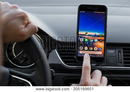 Los Angeles, California - June 6, 2019: Close Up To Male Driving And Using Different Navigation Appl