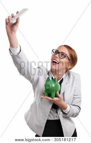 Smiling Beautiful Young Business Woman Dressed In A Suit With Glasses Taking A Selfie With A Green P
