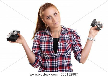 Young Beautiful Woman Dressed In Plaid Shirt Holding Vintage And Modern Camera In Each Hand, Isolate