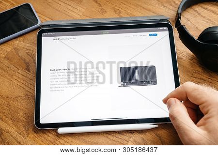Paris, France - Jun 6, 2019: Man Reading On Apple Ipad Pro Tablet About Latest Announcement Of At De