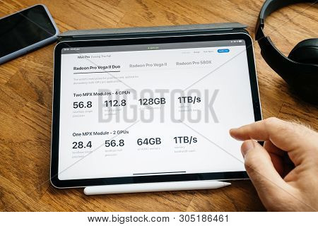 Paris, France - Jun 6, 2019: Man Reading On Apple Ipad Pro Tablet About Latest Announcement Of At De