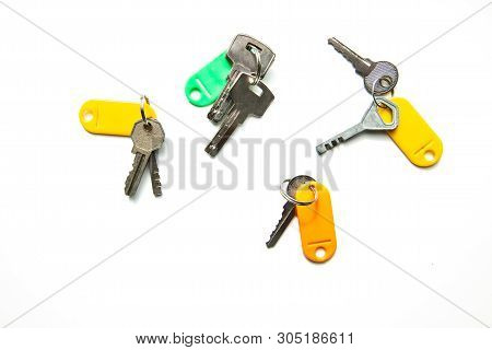 Set Of Many Different Keys Isolated On White Background, Keys With Blank Name Tags, Space For Text. 
