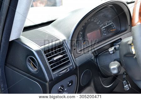 A Close-up View Of A Part Of The Interior Of A Modern Luxury Car With A View Of The Ventilation Defl