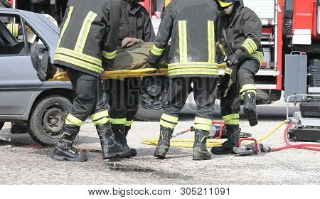 Fire Brigade In Action After The Car Accident