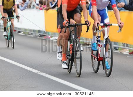 Two Cyclists During The Road Race In Summer