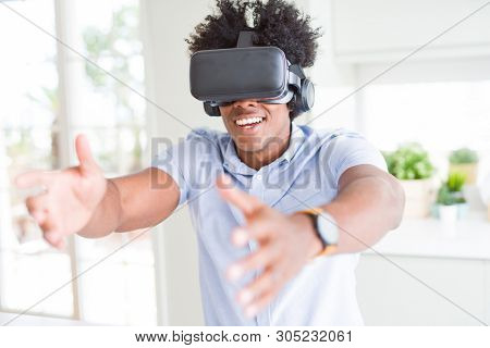 African amaerican man having fun playing with virtual reality glasses