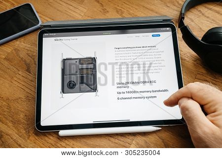 Paris, France - Jun 6, 2019: Man Reading On Apple Ipad Pro Tablet About Latest Announcement Of At De