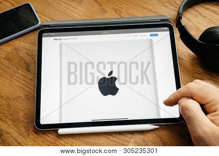 Paris, France - Jun 6, 2019: Man Reading On Apple Ipad Pro Tablet About Latest Announcement Of At De