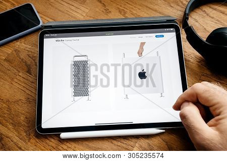 Paris, France - Jun 6, 2019: Man Reading On Apple Ipad Pro Tablet About Latest Announcement Of At Ap