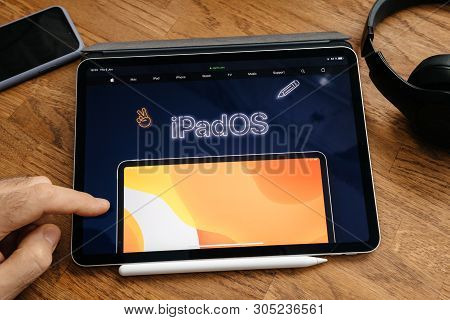 Paris, France - Jun 6, 2019: Man Reading On Apple Ipad Pro Tablet About Latest Announcement Of At Ap