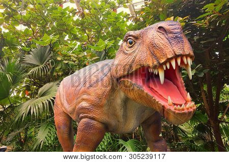 Tyrannosaurus With Open Mouth In The Background A Jungle