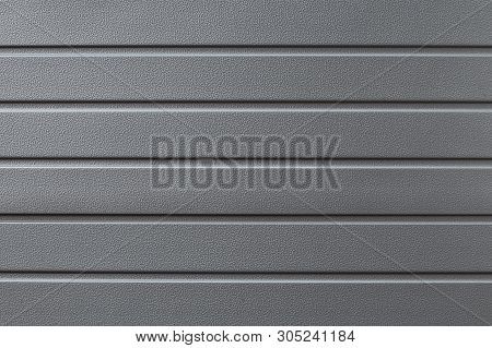 Metal Reflective Gray Grooved Surface. Grey Metalline Background, Texture. Metallic Gate In The Line