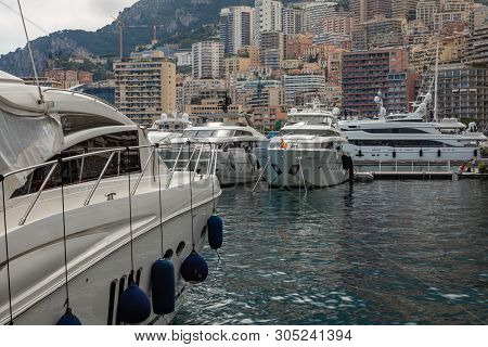 La Condamine, Monaco - June 04, 2019: Yachts Docked At Port Hercules In La Condamine Harbour. Citysc