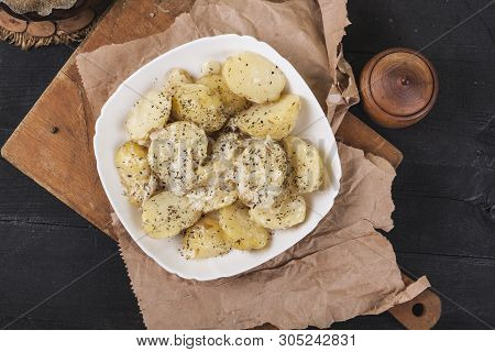 Boiled Potatoes On A White Plate. Dietary Food. Wooden Background, Wooden Cutlery.