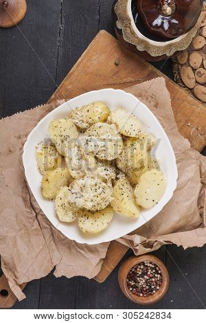 Boiled Potatoes On A White Plate. Dietary Food. Wooden Background, Wooden Cutlery.
