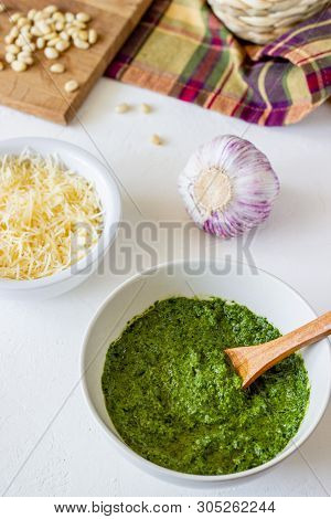 Pesto Sauce And Ingedients On A White Background. Italian Cuisine. Vegetarian Food. The Diet