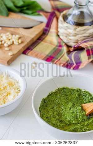 Pesto Sauce And Ingedients On A White Background. Italian Cuisine. Vegetarian Food. The Diet
