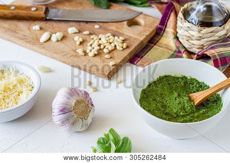 Pesto Sauce And Ingedients On A White Background. Italian Cuisine. Vegetarian Food. The Diet