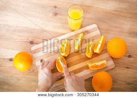 Cooking, Food And Concept Of Veganism, Vigor And Healthy Eating - Close Up Of Female Hand Cutting Or