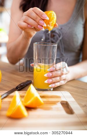 Cooking, Food And Concept Of Veganism, Vigor And Healthy Eating - Close Up Of Female Hand Squeeze Fr