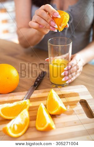 Cooking, Food And Concept Of Veganism, Vigor And Healthy Eating - Close Up Of Female Hand Squeeze Fr