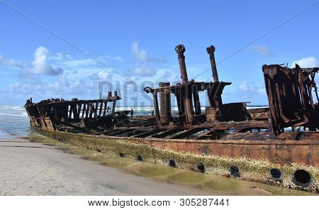 The Rusty Wreck Of The Vessel Maheno On The Shores Of Fraser Island (queensland, Australia). The Ant