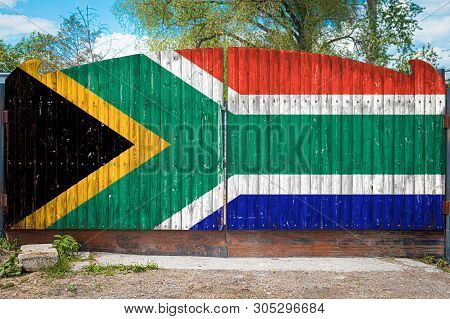 Close-up Of The National Flag Of South African Republic On A Wooden Gate At The Entrance To The Clos
