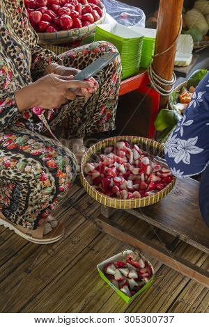 The Seller Is Cutting Water Guava For Making Traditional Food Rujak At A Busy Street Food Market