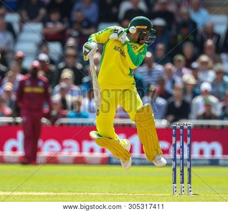 NOTTINGHAM, ENGLAND. 06 JUNE 2019:  Usman Khawaja of Australia gets hit in the head off the bowling of Oshane Thomas of West Indies  during the Australia against West Indies, ICC Cricket World Cup